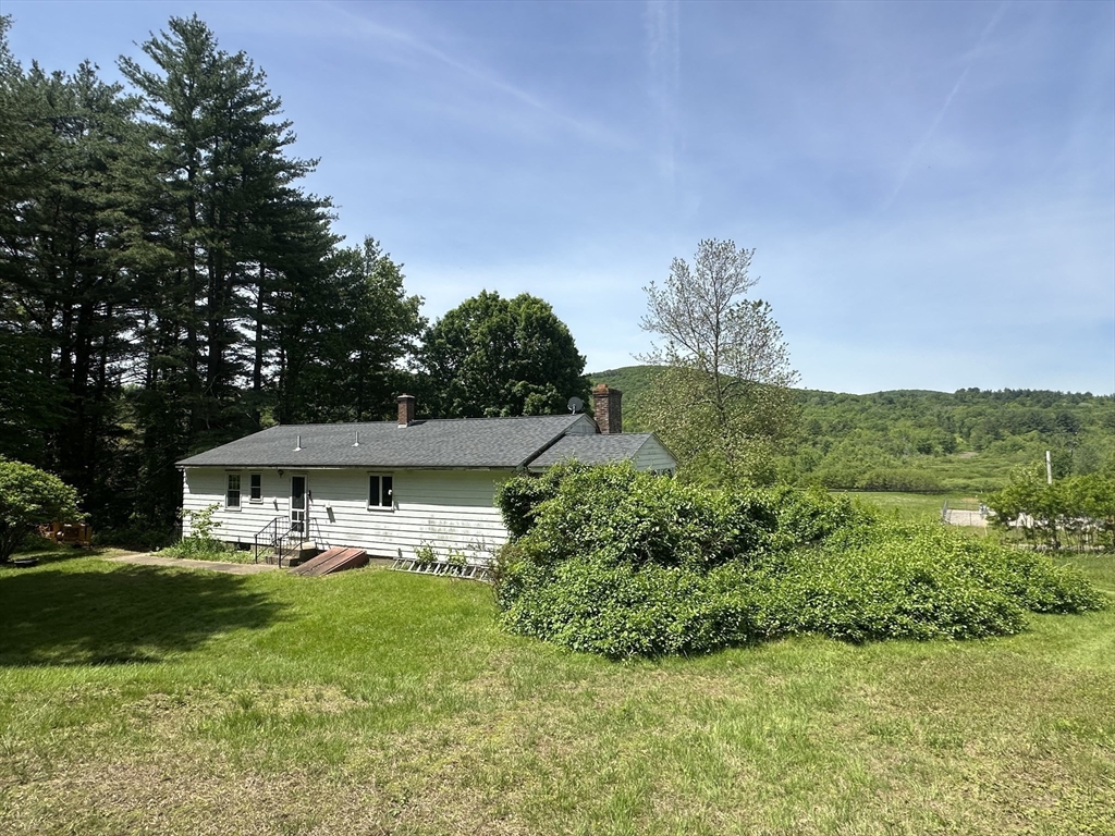189 Scantic Road Hampden, MA 01036 - Photo 25 of 42 a front view of a house with garden