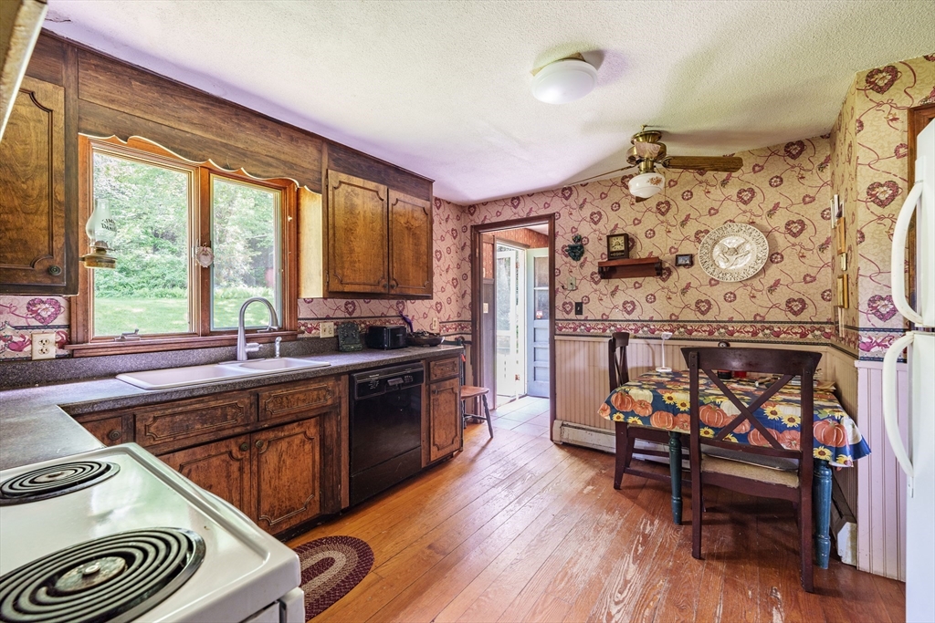 189 Scantic Road Hampden, MA 01036 - Photo 30 of 42 a kitchen with stainless steel appliances granite countertop a stove a sink and a refrigerator