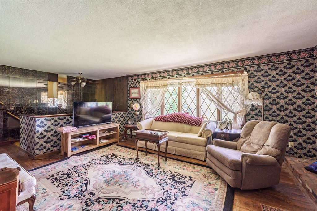 189 Scantic Road Hampden, MA 01036 - Photo 31 of 42 a living room with furniture and a rug