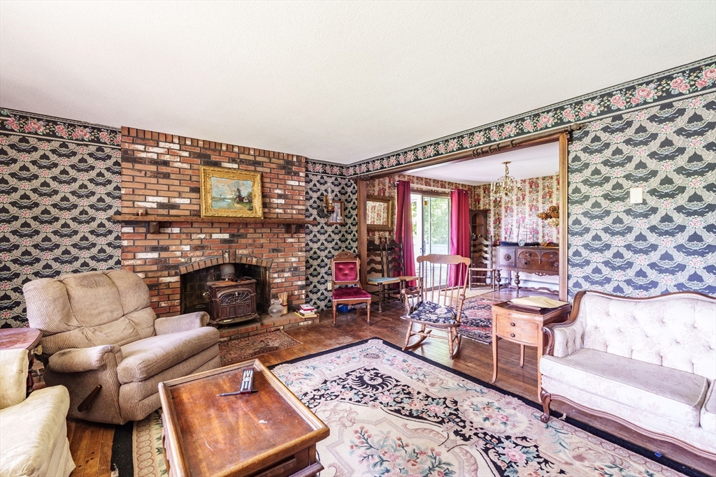 189 Scantic Road Hampden, MA 01036 - Photo 33 of 42 a living room with furniture and a fireplace