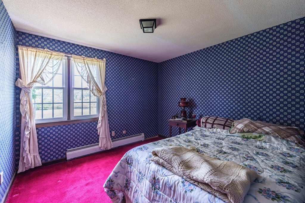 189 Scantic Road Hampden, MA 01036 - Photo 35 of 42 a bedroom with a bed and a window