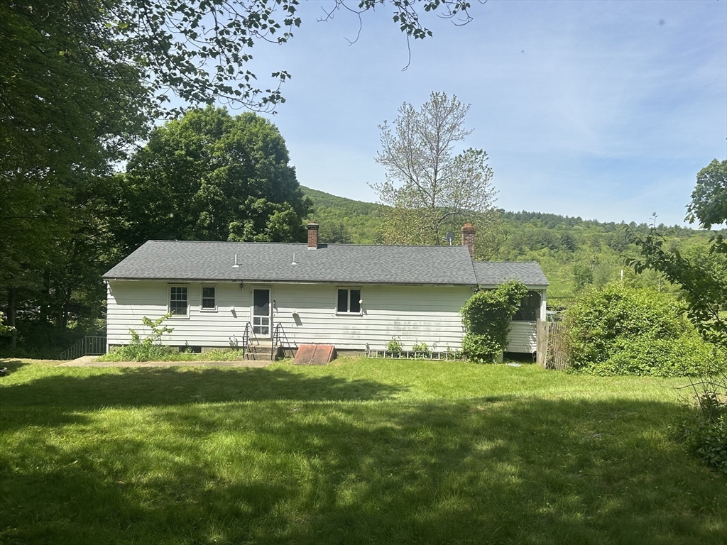 189 Scantic Road Hampden, MA 01036 - Photo 8 of 42 a view of a house with a yard patio and sitting area