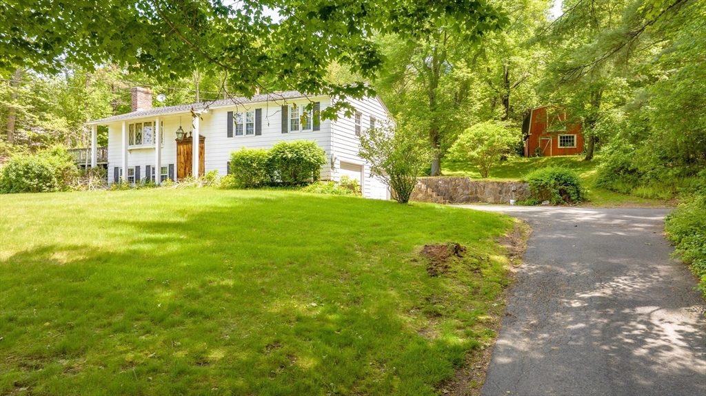 189 Scantic Road Hampden, MA 01036 - Photo 10 of 42 a front view of a house with a yard