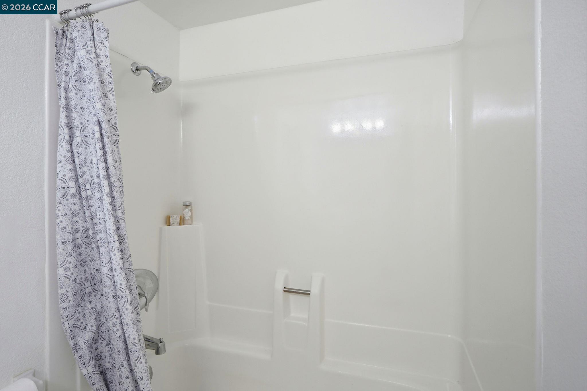 1255 Detroit Avenue, Unit 3 Concord, CA 94520 - Photo 21 of 30 a bathroom with a shower curtain