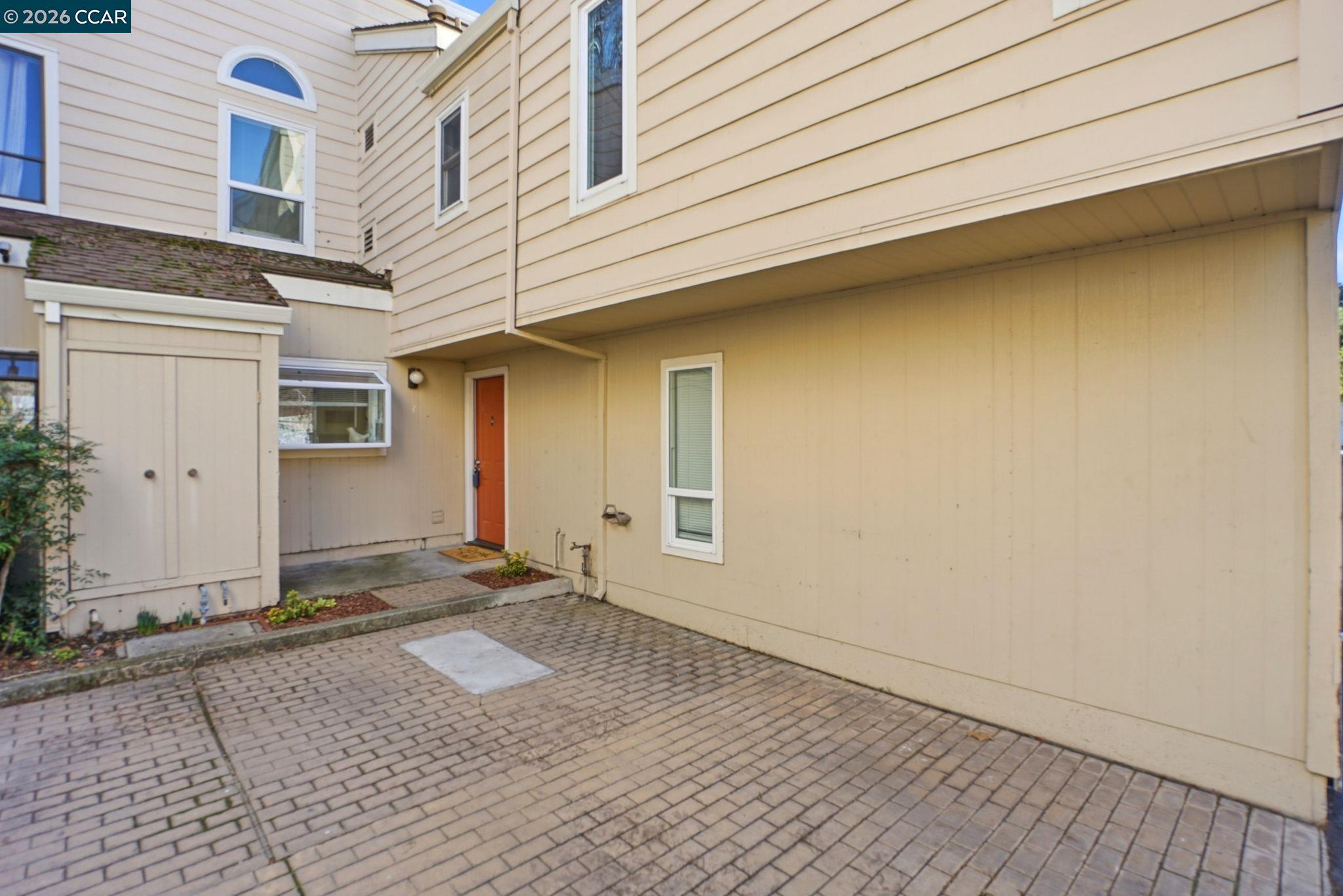 1255 Detroit Avenue, Unit 3 Concord, CA 94520 - Photo 27 of 30 a view of a house with a wooden bench