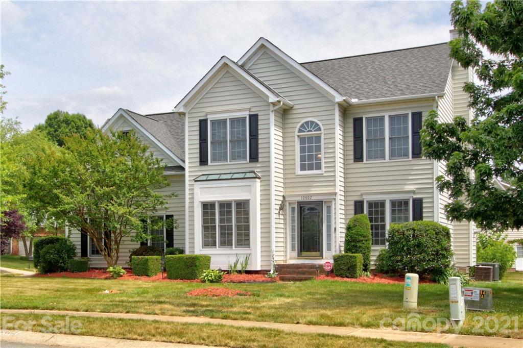 10402 Friarsgate Road Huntersville, NC 28078 - Photo 2 of 46 a front view of a house with a yard