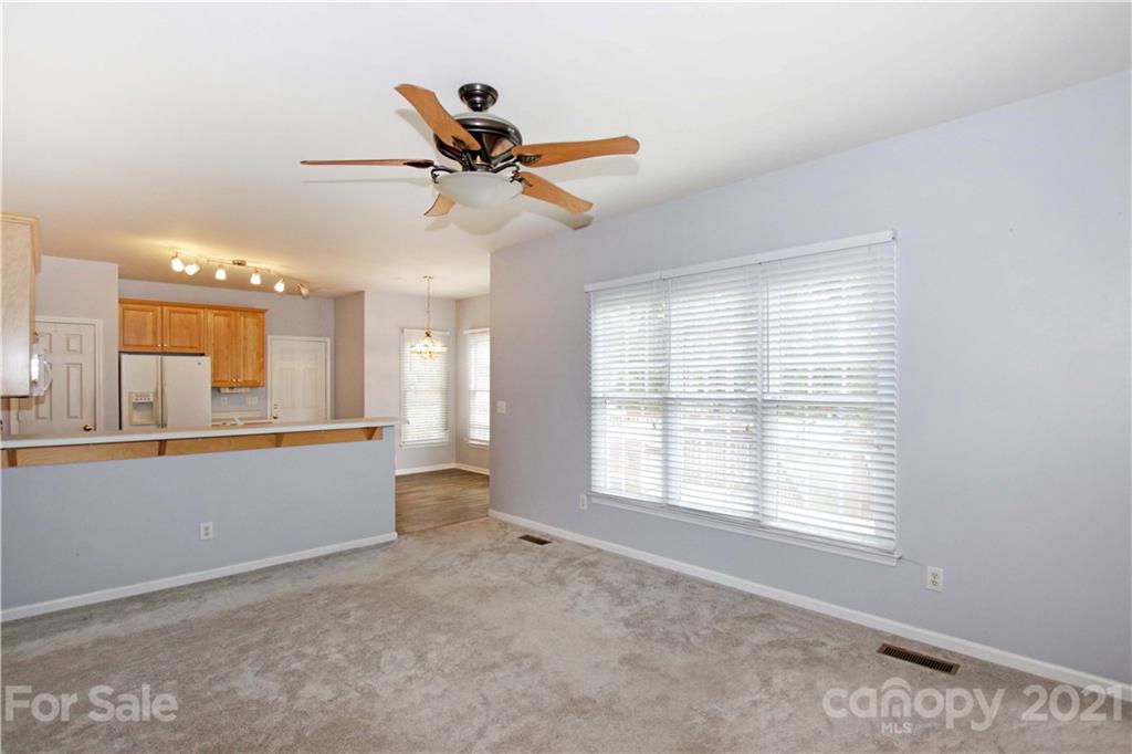 10402 Friarsgate Road Huntersville, NC 28078 - Photo 13 of 46 a living room with furniture and a window