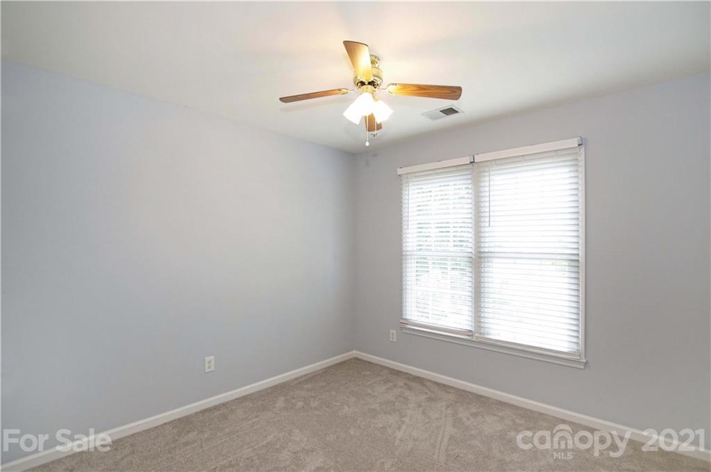 10402 Friarsgate Road Huntersville, NC 28078 - Photo 28 of 46 an empty room with a window