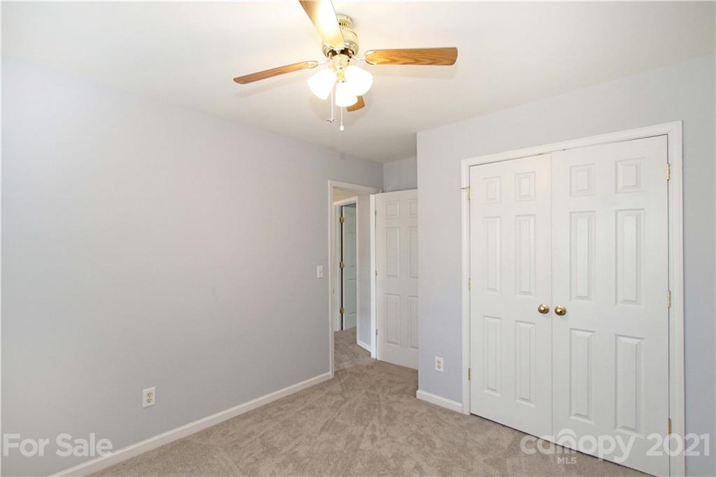 10402 Friarsgate Road Huntersville, NC 28078 - Photo 29 of 46 an empty room with windows and fan