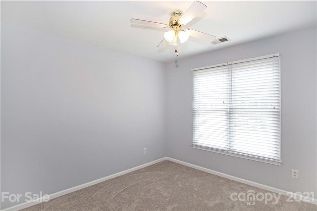 10402 Friarsgate Road Huntersville, NC 28078 - Photo 30 of 46 an empty room with a window