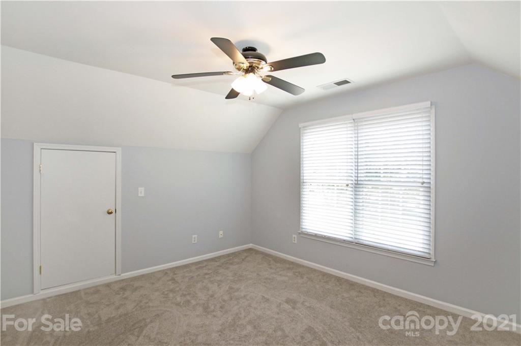 10402 Friarsgate Road Huntersville, NC 28078 - Photo 34 of 46 a view of an empty room with a window