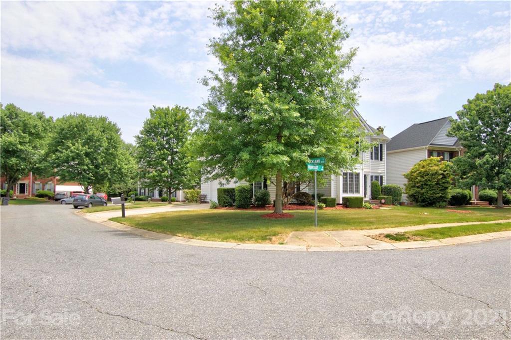 10402 Friarsgate Road Huntersville, NC 28078 - Photo 44 of 46 a view of a house with a big yard and large trees