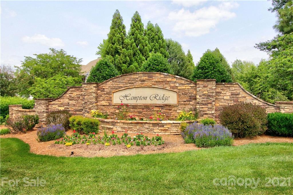 10402 Friarsgate Road Huntersville, NC 28078 - Photo 45 of 46 a view of a white house with a yard