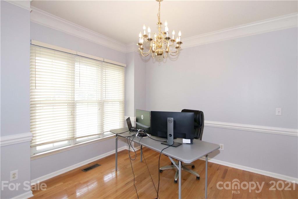 10402 Friarsgate Road Huntersville, NC 28078 - Photo 6 of 46 a workspace with furniture a rug and a window