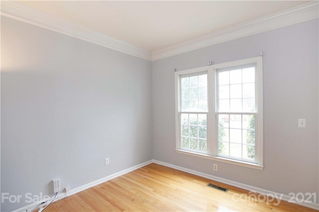10402 Friarsgate Road Huntersville, NC 28078 - Photo 7 of 46 an empty room with a window