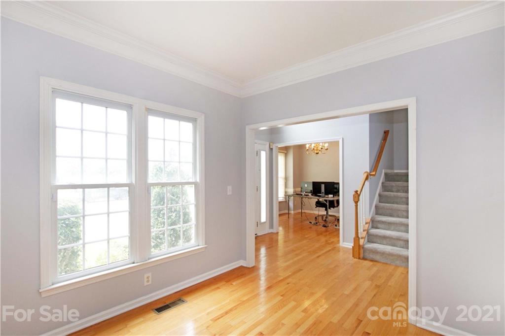 10402 Friarsgate Road Huntersville, NC 28078 - Photo 8 of 46 wooden floor in an empty room with a window