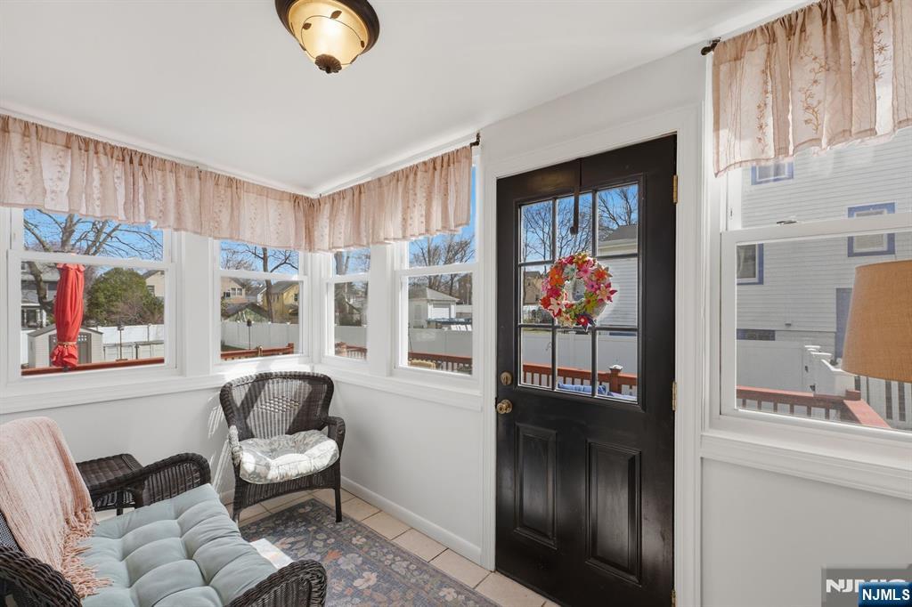 385 Berkeley Avenue Bloomfield, NJ 07003 - Photo 31 of 39 a living room with furniture and a large window