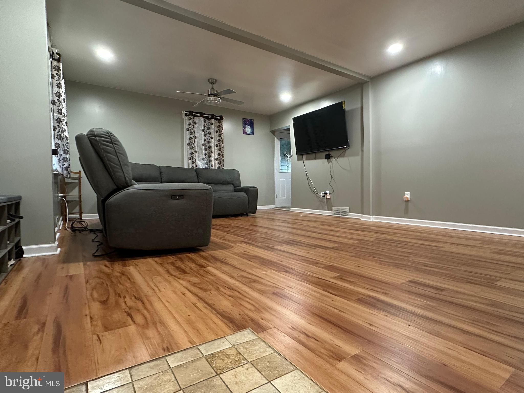 102 Philmar Avenue Cherry Hill, NJ 08003 - Photo 3 of 10 a living room with furniture and a flat screen tv