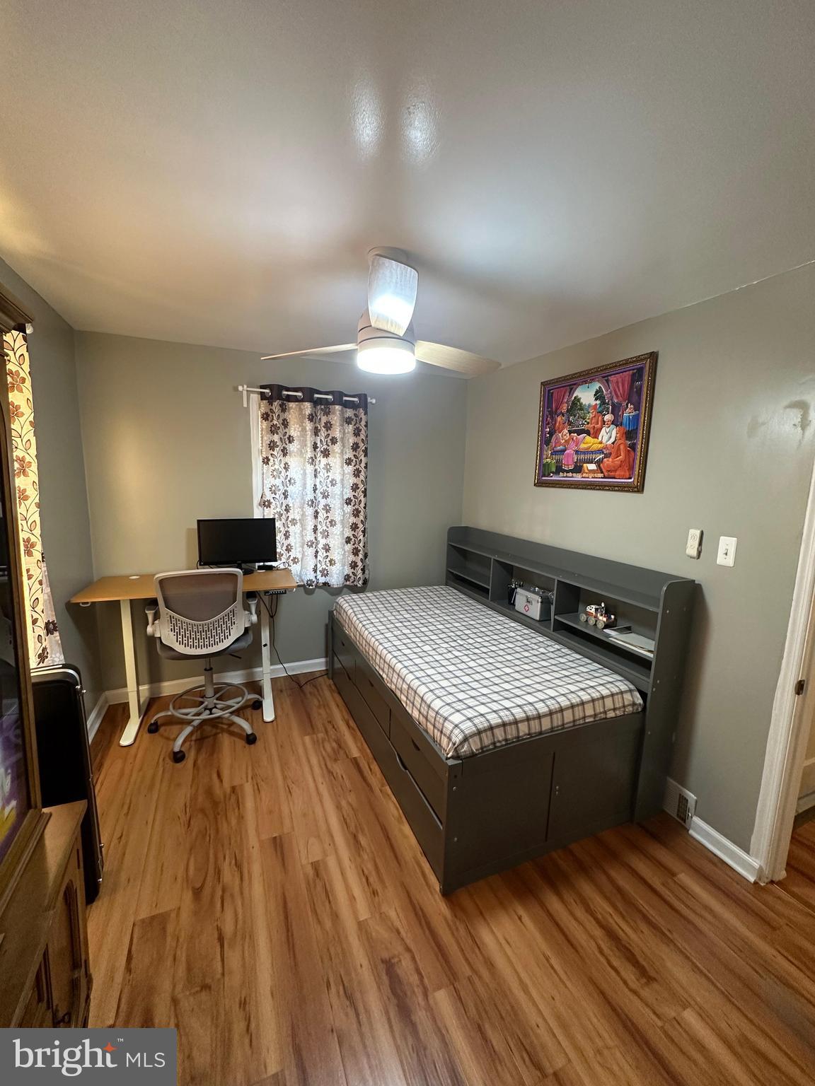 102 Philmar Avenue Cherry Hill, NJ 08003 - Photo 5 of 10 a spacious bedroom with a bed and a table in it