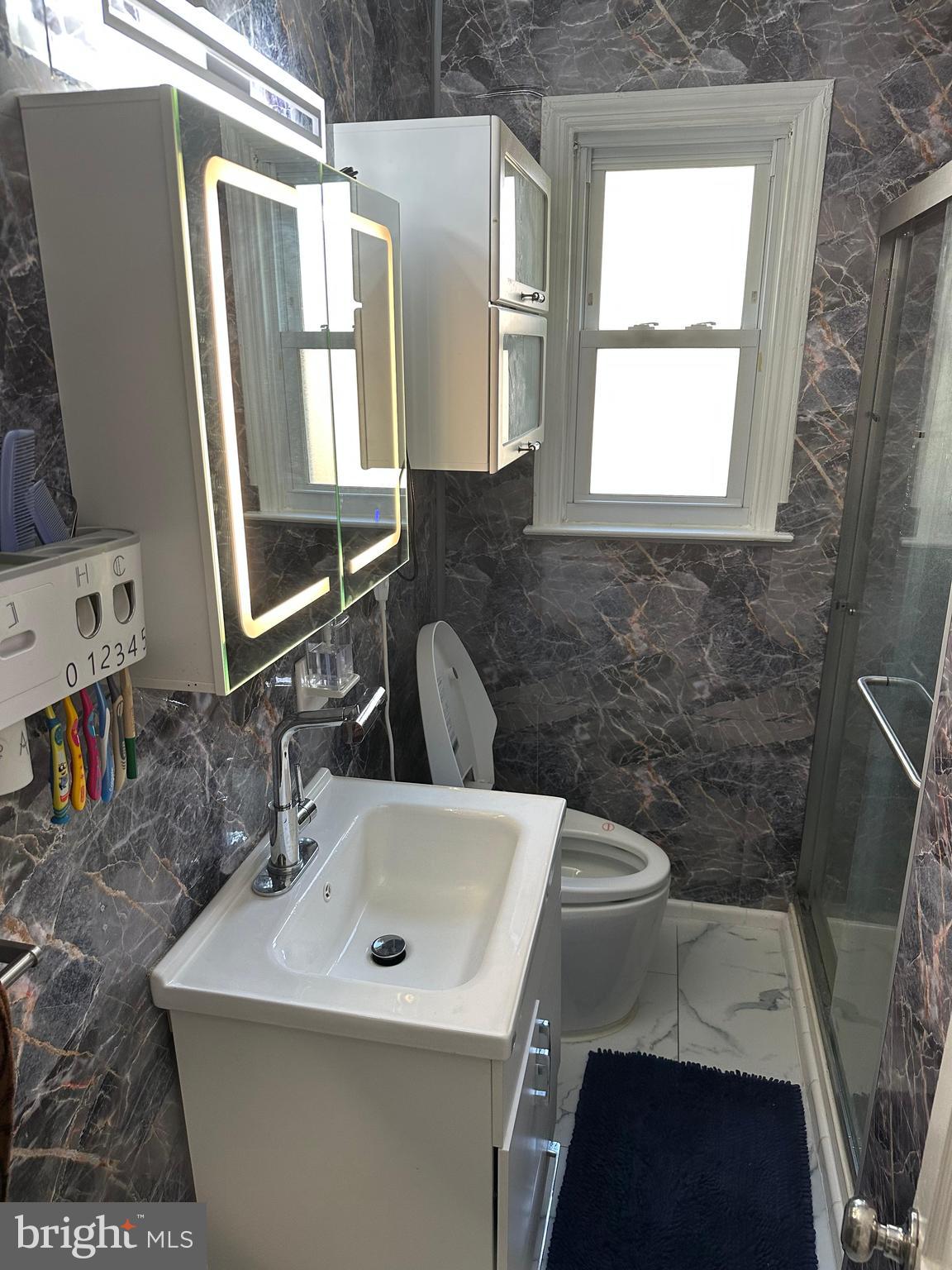 102 Philmar Avenue Cherry Hill, NJ 08003 - Photo 6 of 10 a bathroom with a sink and a mirror