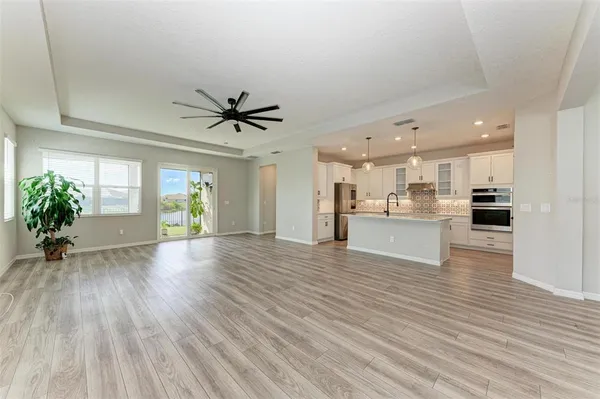 a view of kitchen with cabinets and wooden floor