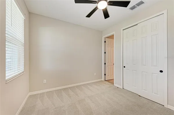 a view of an empty room and window