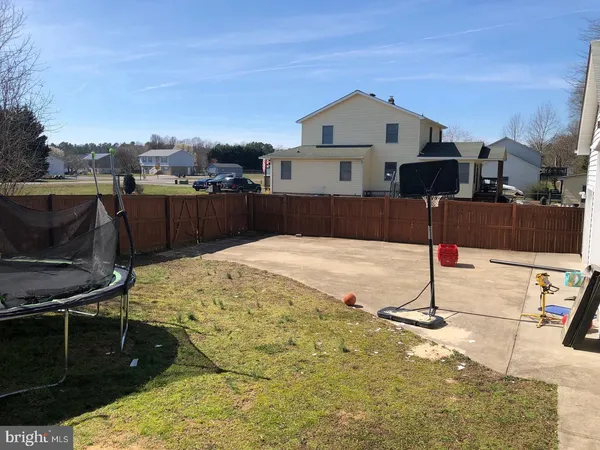 a house view with a backyard space