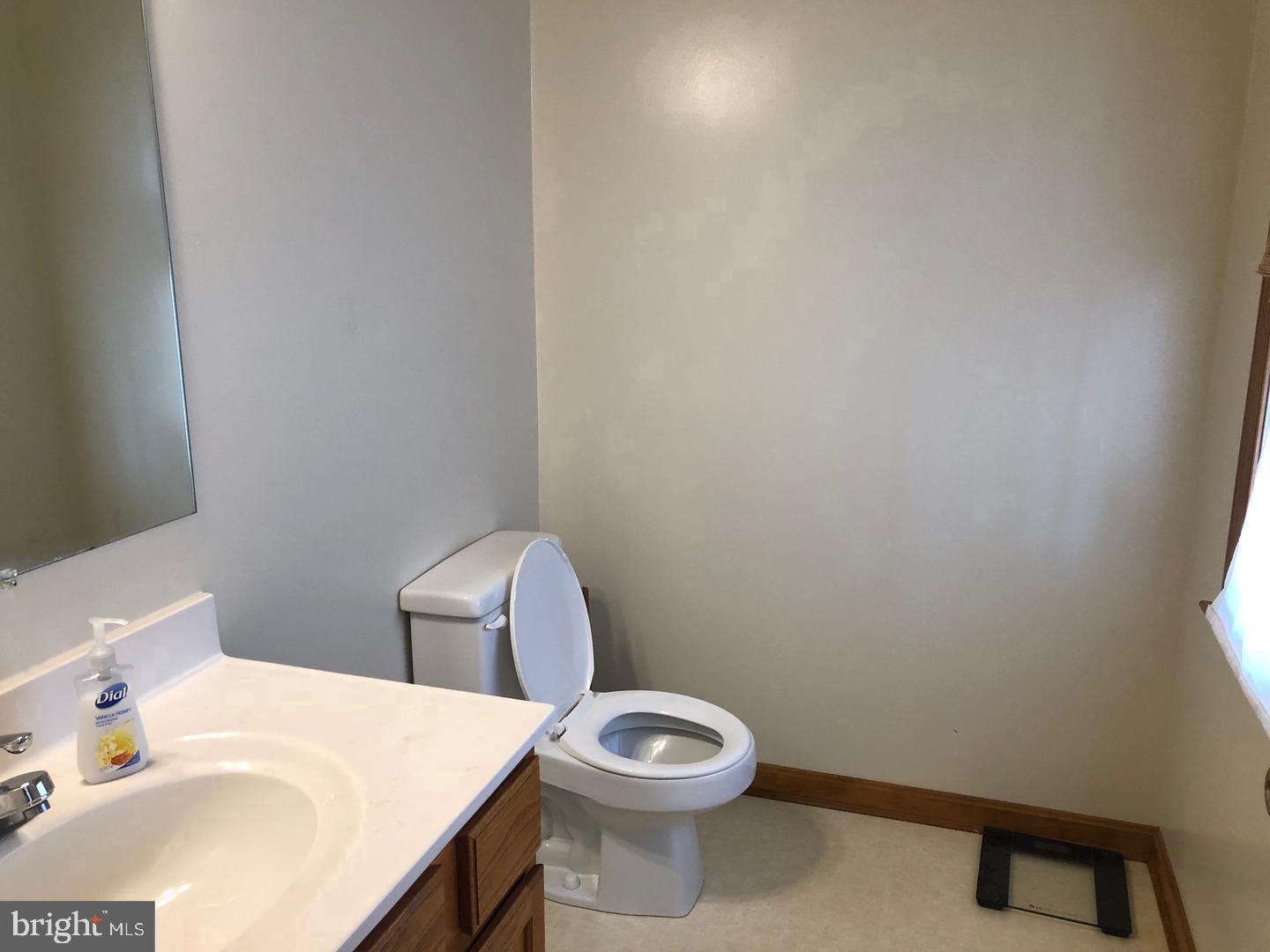 45636 Rutherford Boulevard Great Mills, MD 20634 - Photo 6 of 15 a white toilet sitting next to a bathroom sink