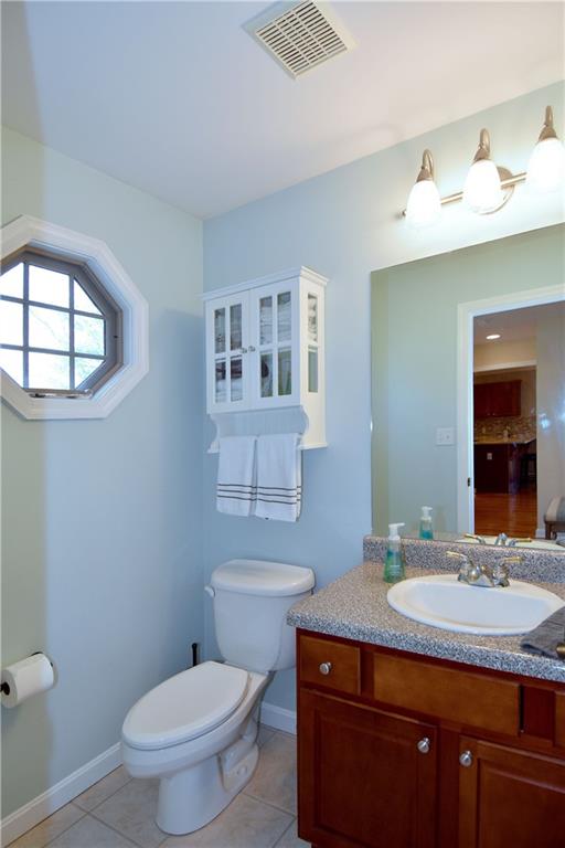 107 Beacon Hill Drive Cranberry Township, PA 16066 - Photo 11 of 25 a bathroom with a granite countertop sink toilet and mirror