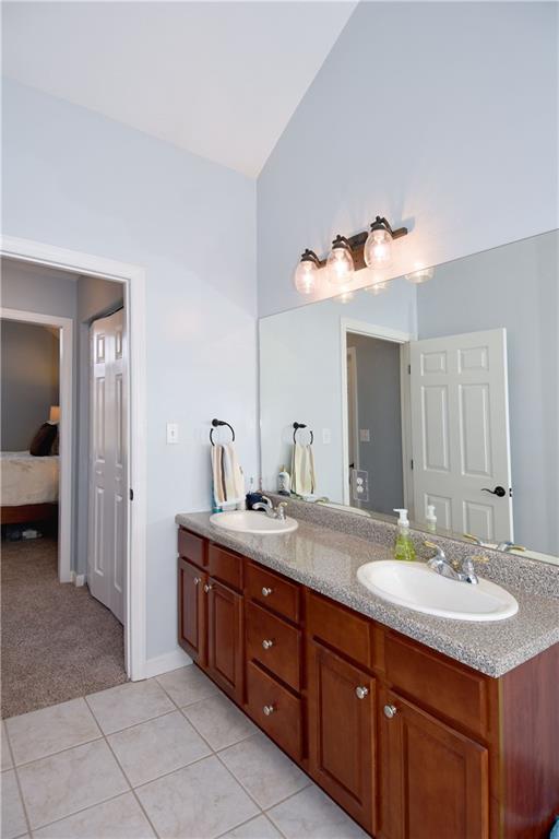107 Beacon Hill Drive Cranberry Township, PA 16066 - Photo 15 of 25 a bathroom with a double vanity sink and a mirror