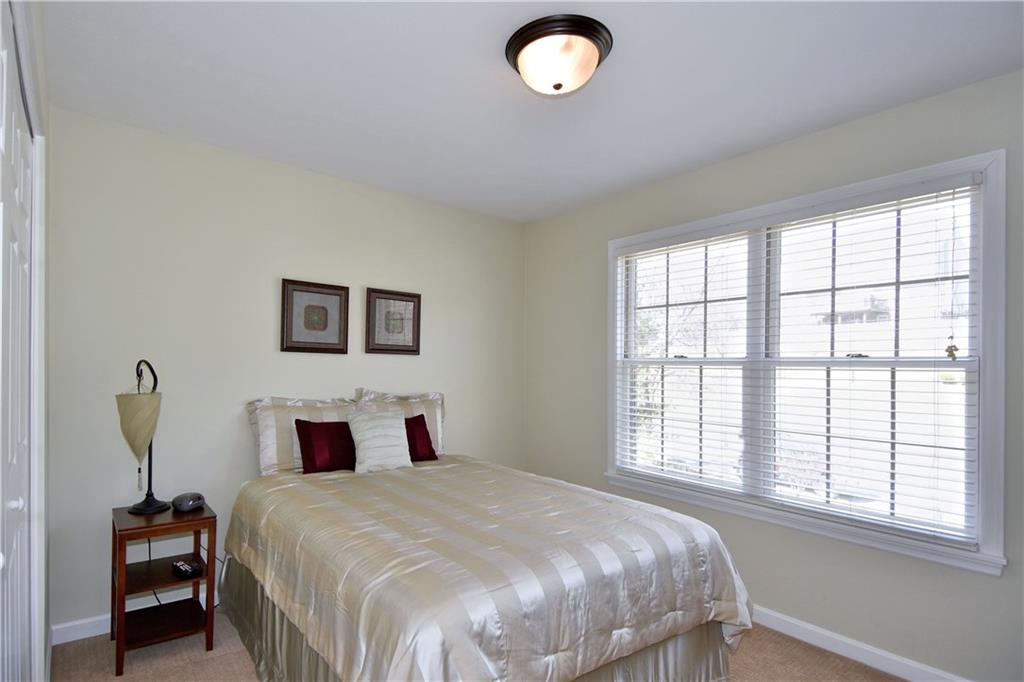 107 Beacon Hill Drive Cranberry Township, PA 16066 - Photo 17 of 25 a bedroom with a large bed and a window