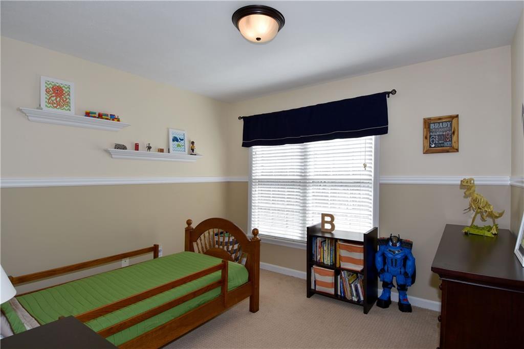 107 Beacon Hill Drive Cranberry Township, PA 16066 - Photo 18 of 25 a bedroom with furniture and a window