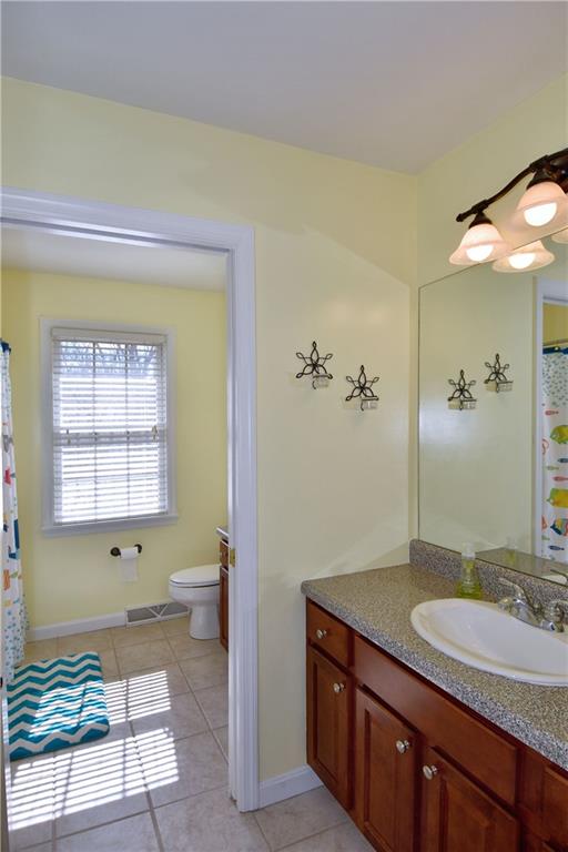 107 Beacon Hill Drive Cranberry Township, PA 16066 - Photo 19 of 25 a spacious bathroom with a granite countertop sink and a mirror