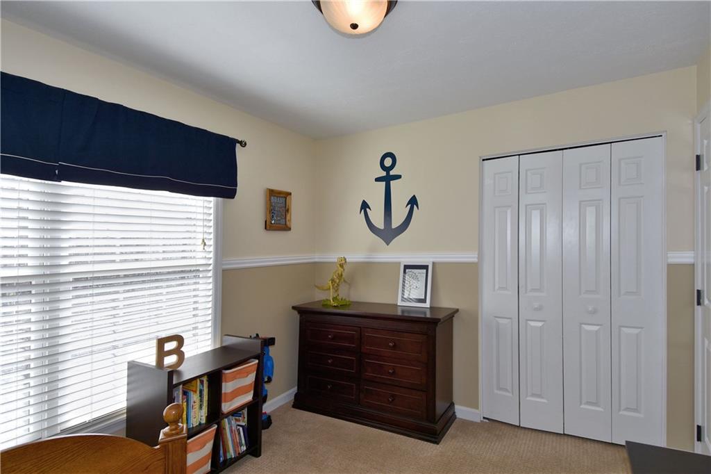 107 Beacon Hill Drive Cranberry Township, PA 16066 - Photo 20 of 25 a room with furniture and window