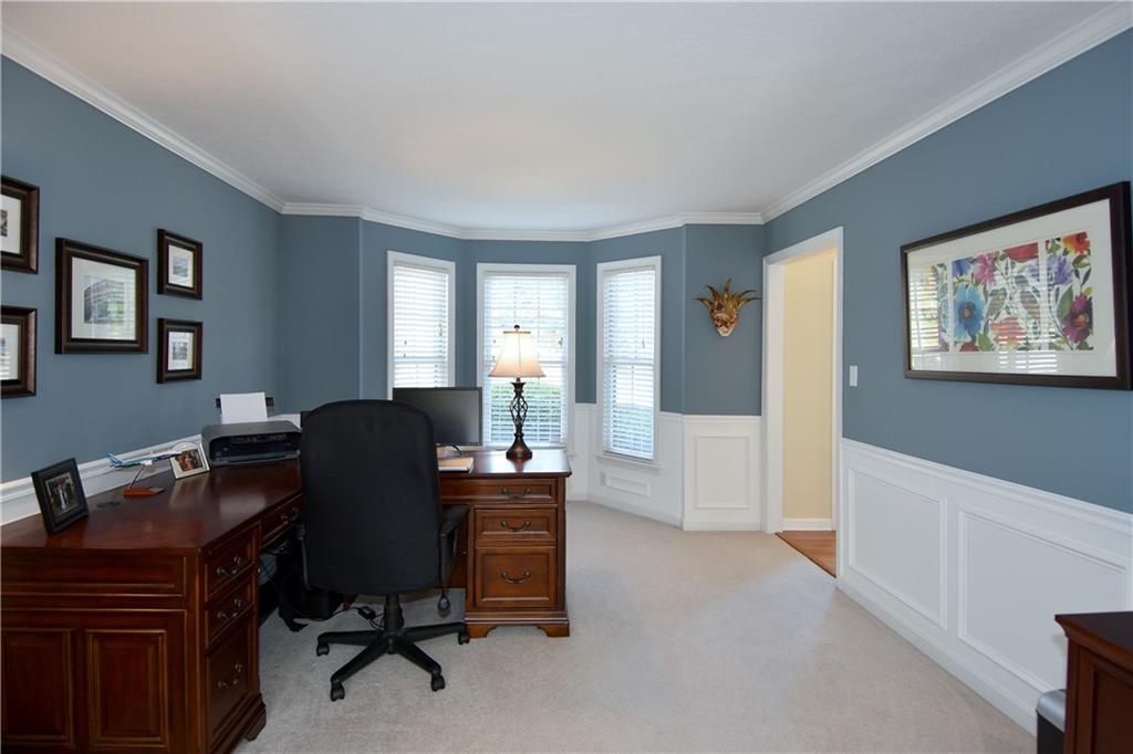 107 Beacon Hill Drive Cranberry Township, PA 16066 - Photo 3 of 25 a view of a workspace with furniture and a window