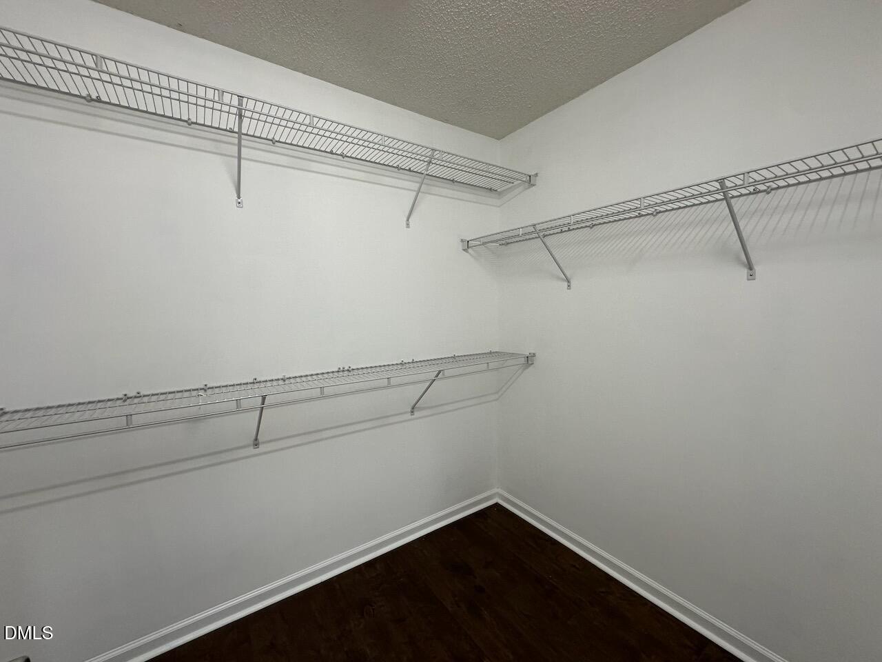 4617 Six Siblings Circle Raleigh, NC 27610 - Photo 20 of 35 a view of a room with racks on the wall