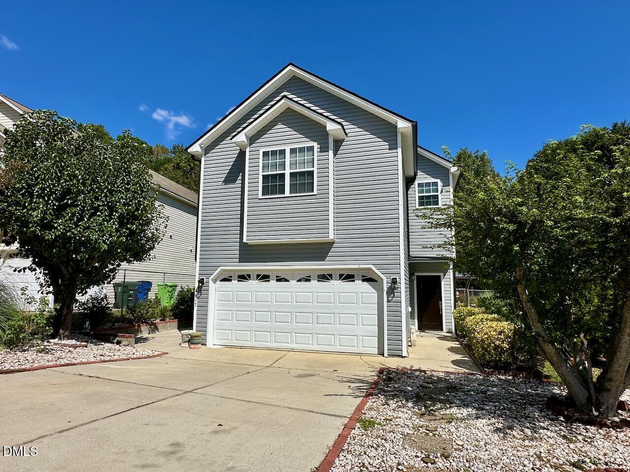4617 Six Siblings Circle Raleigh, NC 27610 - Photo 2 of 35 a front view of a house with a yard
