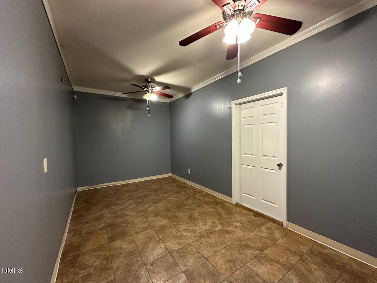 4617 Six Siblings Circle Raleigh, NC 27610 - Photo 24 of 35 an empty room with a ceiling fan and fan