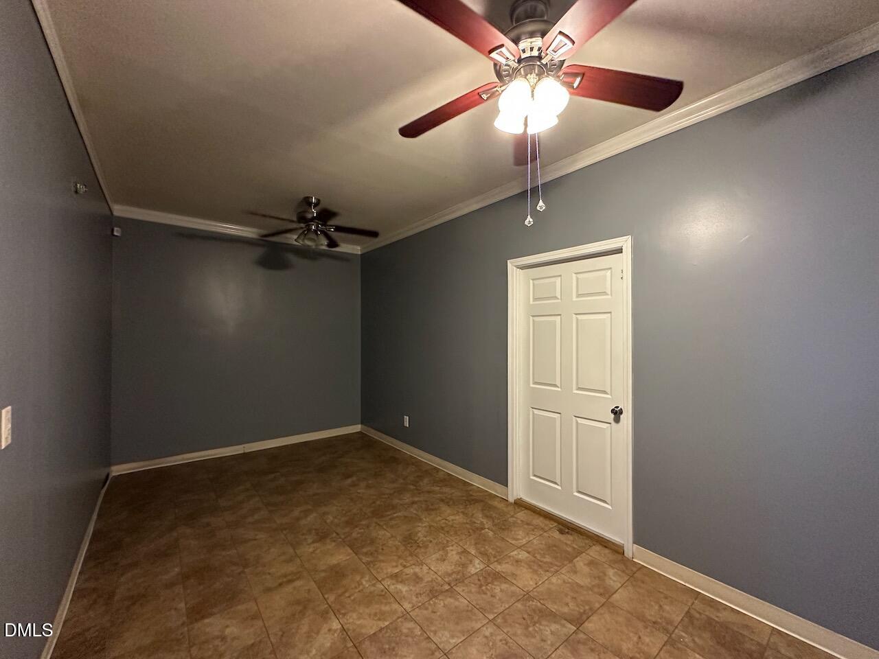 4617 Six Siblings Circle Raleigh, NC 27610 - Photo 25 of 35 an empty room with windows and fan