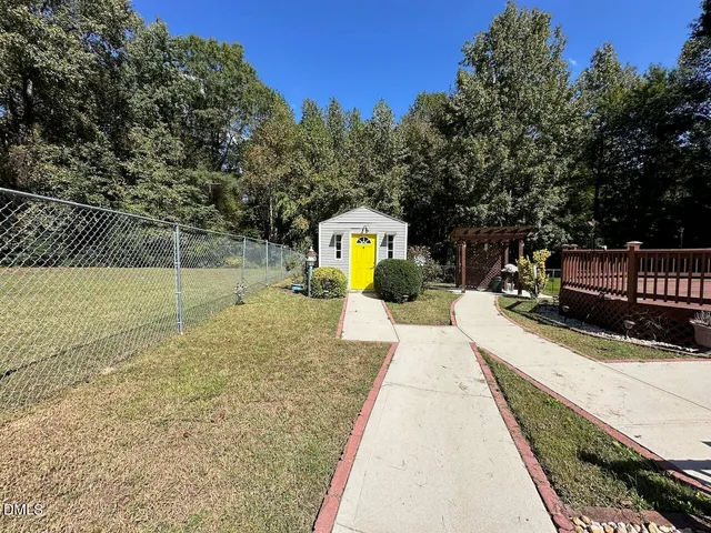 a balcony with wooden floor and city view