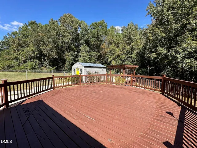 a view of a porch with wooden floor