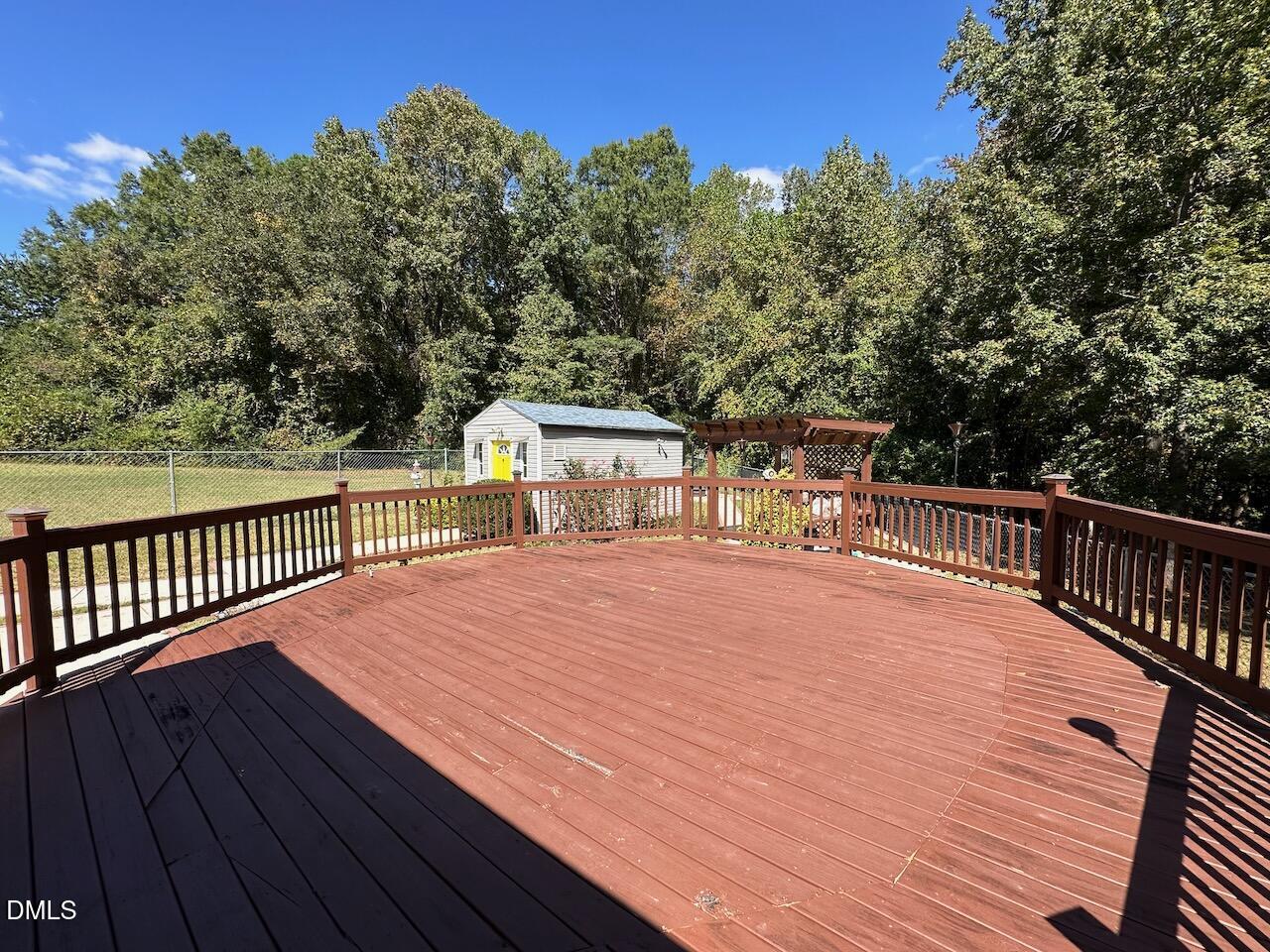 4617 Six Siblings Circle Raleigh, NC 27610 - Photo 30 of 35 a balcony with wooden floor and city view