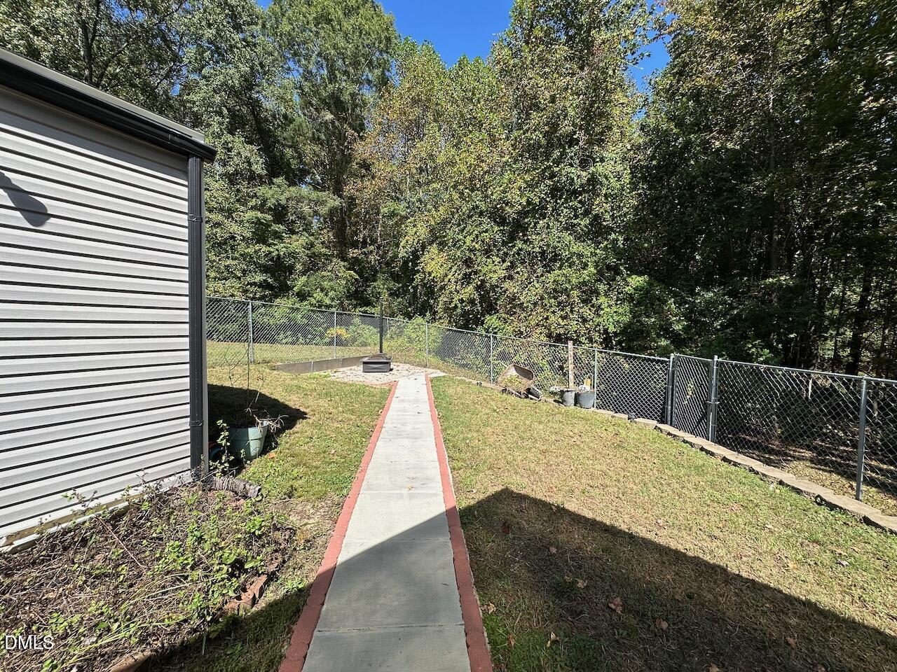 4617 Six Siblings Circle Raleigh, NC 27610 - Photo 35 of 35 a view of a swimming pool with a patio