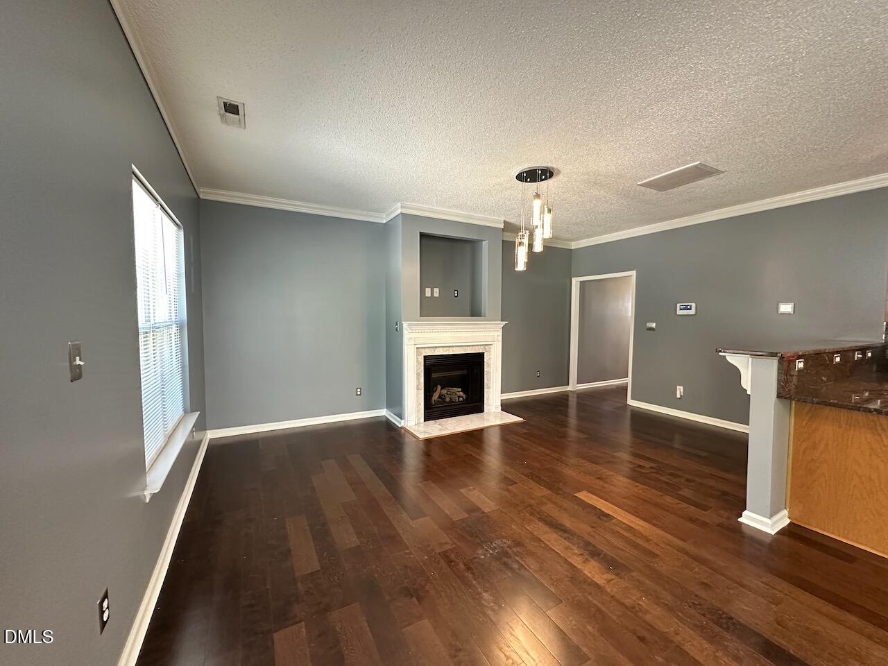 4617 Six Siblings Circle Raleigh, NC 27610 - Photo 6 of 35 wooden floor in an empty room with a window