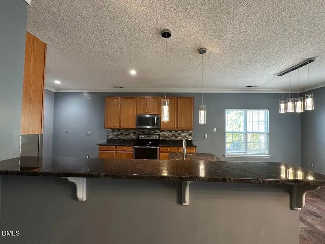 a kitchen with sink and window