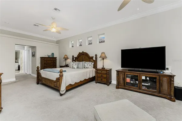 a kitchen with a sink and chairs
