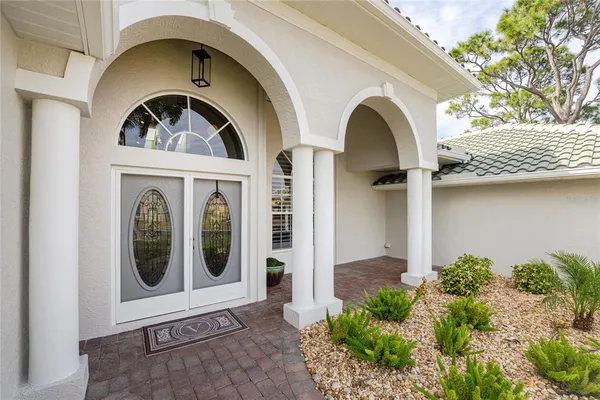 a living room with lots of furniture and kitchen view
