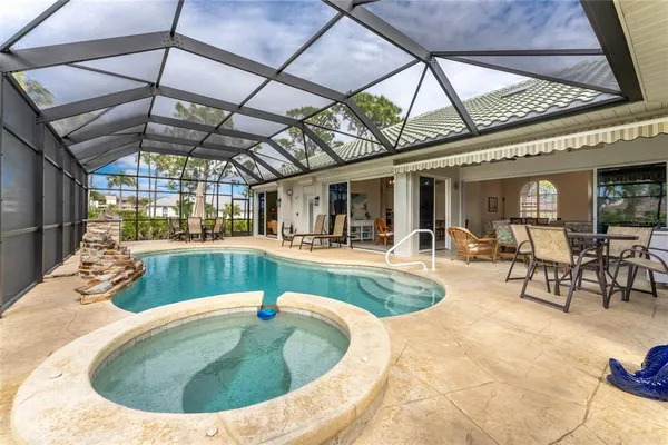 an aerial view of a house with a ocean view