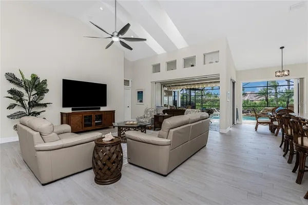 a view of a dining room with furniture and wooden floor