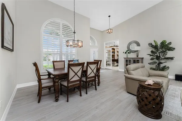 a view of a dining room with furniture and wooden floor